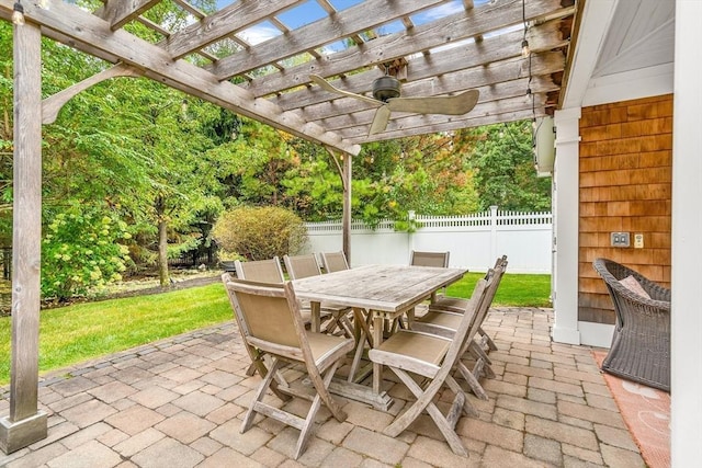 view of patio featuring a pergola, fence, and outdoor dining area
