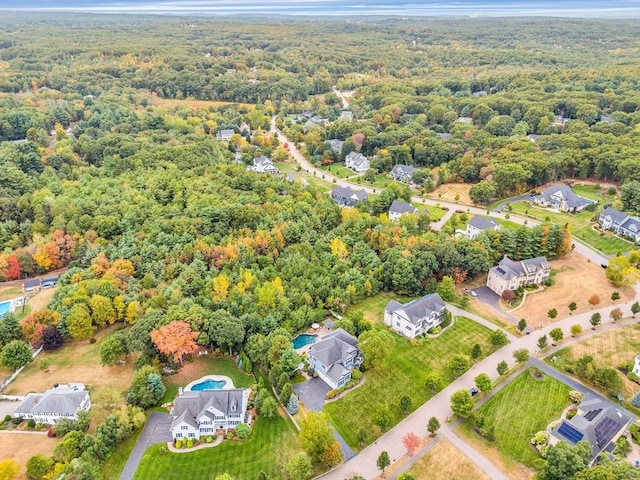 drone / aerial view featuring a view of trees