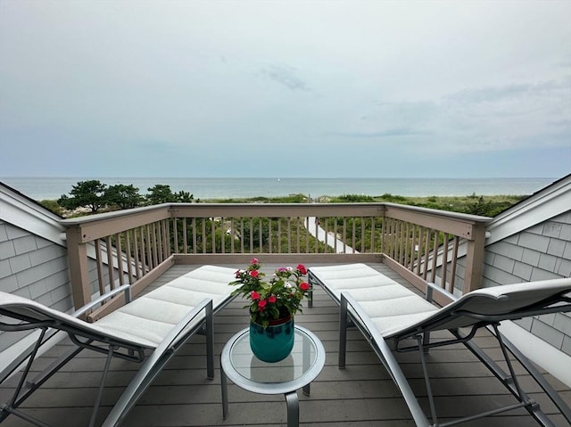 wooden deck featuring a water view