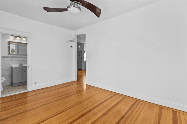 interior space featuring wood-type flooring and ceiling fan