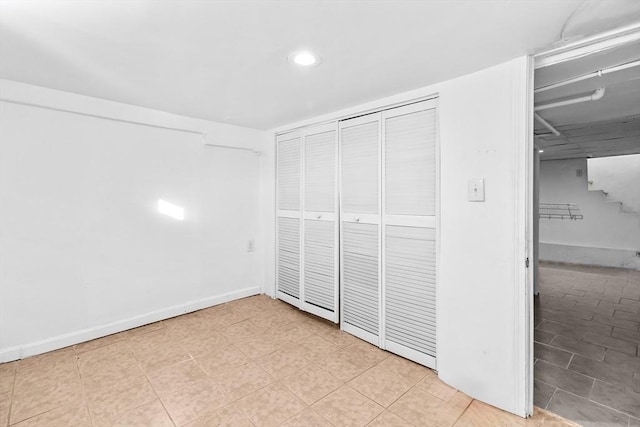 unfurnished bedroom with a closet