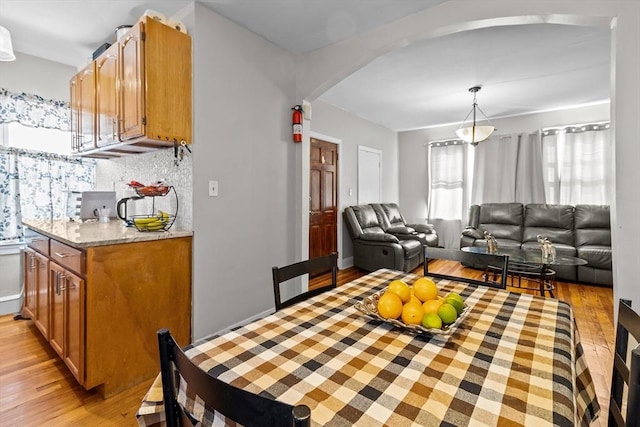 dining space featuring light wood-type flooring