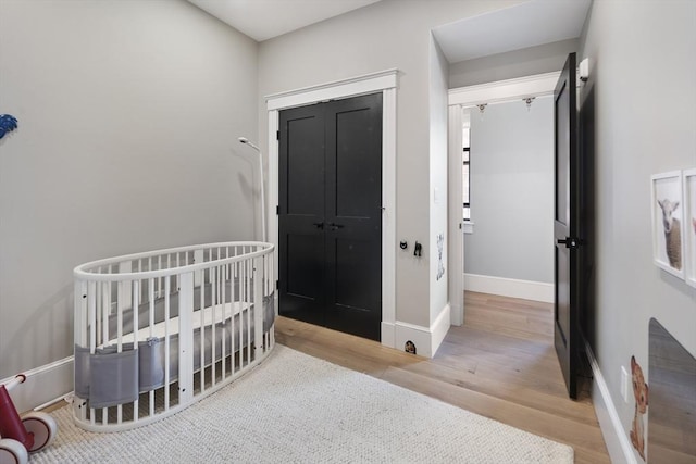 40 Mount Vernon St Unit 2, Boston, MA 02129 - bedroom featuring wood finished floors and a nursery area