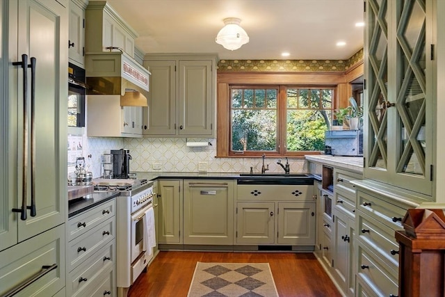 23 Newmarch St, Ipswich, MA 01938 - kitchen with a sink, high end range, dark countertops, decorative backsplash, and dark wood-style flooring