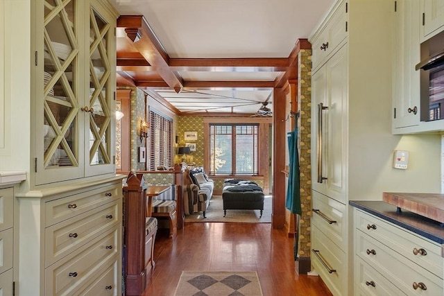 23 Newmarch St, Ipswich, MA 01938 - spacious closet with dark wood-style floors, coffered ceiling, a ceiling fan, and beam ceiling