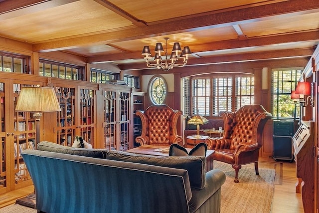 23 Newmarch St, Ipswich, MA 01938 - living room featuring a chandelier, light wood-style flooring, beam ceiling, coffered ceiling, and wooden walls