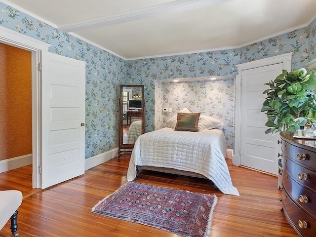 23 Newmarch St, Ipswich, MA 01938 - bedroom with wood finished floors, crown molding, wallpapered walls, and baseboards