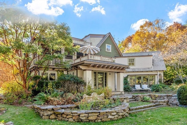 23 Newmarch St, Ipswich, MA 01938 - back of house with a balcony, stucco siding, a yard, and a patio area