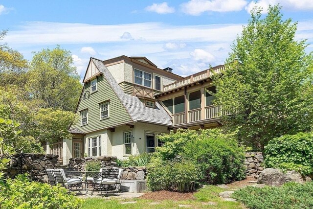 23 Newmarch St, Ipswich, MA 01938 - back of property featuring stucco siding and a balcony