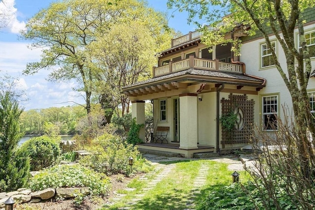 23 Newmarch St, Ipswich, MA 01938 - back of property with stucco siding and a balcony