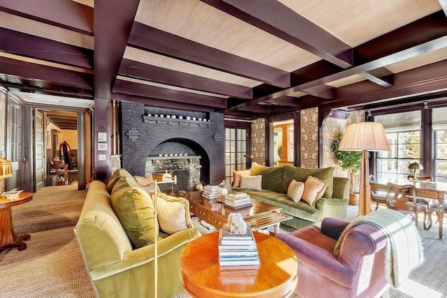 23 Newmarch St, Ipswich, MA 01938 - living area with a large fireplace, beamed ceiling, and carpet