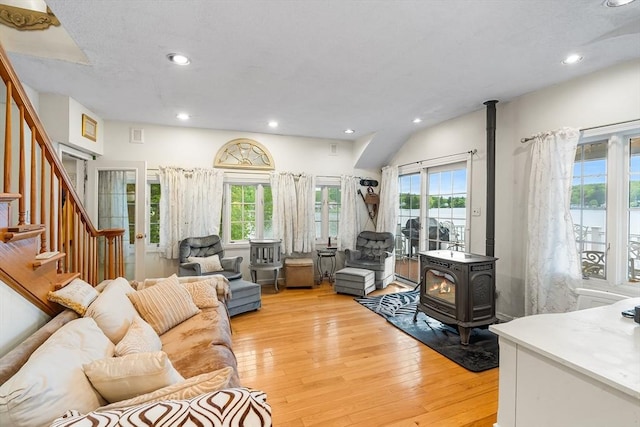 11 Bayside Dr, Wales, MA 01081 - living room with a wood stove, healthy amount of natural light, light wood finished floors, recessed lighting, and stairs