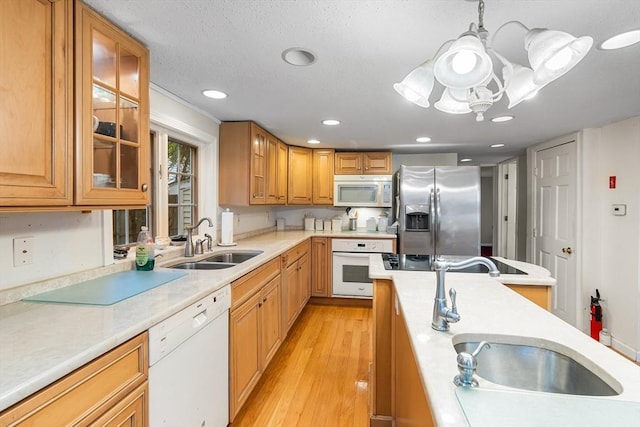 11 Bayside Dr, Wales, MA 01081 - kitchen featuring white appliances, a sink, light wood-style flooring, light countertops, and recessed lighting