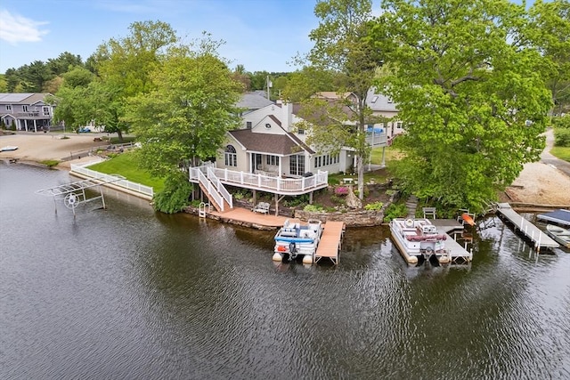 11 Bayside Dr, Wales, MA 01081 - dock area featuring boat lift and a deck with water view