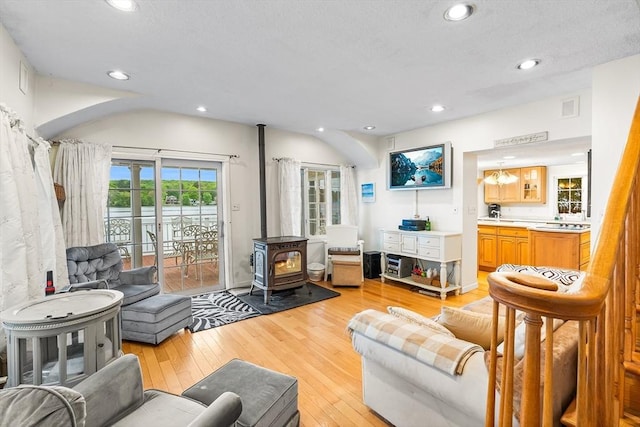 11 Bayside Dr, Wales, MA 01081 - living area with a wood stove, light wood-style flooring, and recessed lighting
