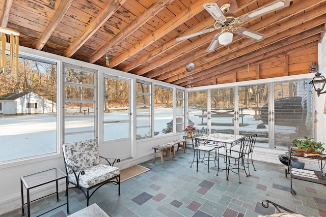 sunroom / solarium with wood ceiling, ceiling fan, and vaulted ceiling with beams