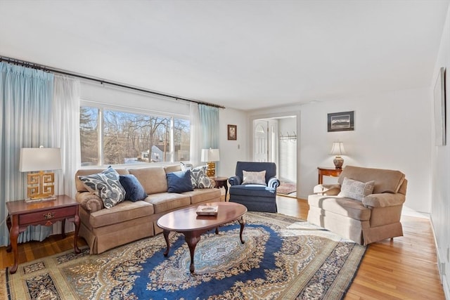 living room with light hardwood / wood-style flooring