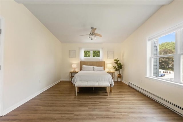 14 Carlson Cv, Weymouth, MA 02189 - bedroom featuring baseboard heating, light wood-style flooring, baseboards, and a ceiling fan