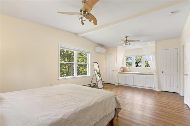 14 Carlson Cv, Weymouth, MA 02189 - bedroom with wood finished floors, an AC wall unit, ceiling fan, and ensuite bath
