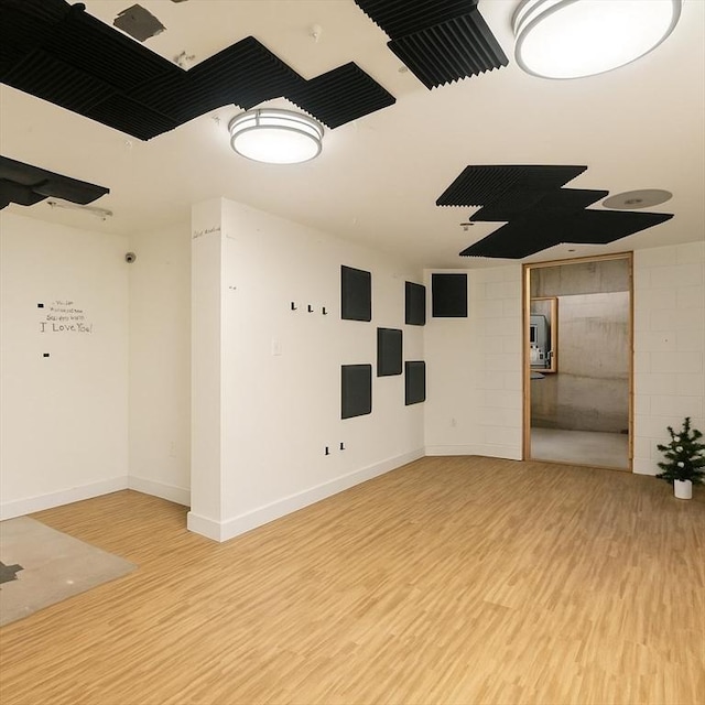 14 Carlson Cv, Weymouth, MA 02189 - spare room featuring light wood-type flooring, baseboards, and concrete block wall