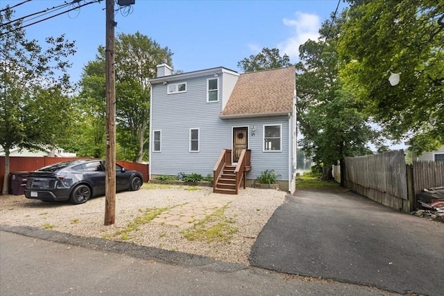 14 Carlson Cv, Weymouth, MA 02189 - view of front facade with a chimney and roof with shingles