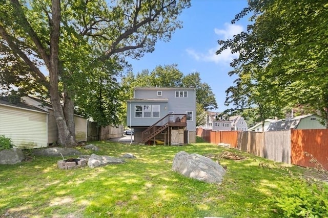 14 Carlson Cv, Weymouth, MA 02189 - rear view of house with stairs, an outdoor fire pit, and a wooden deck