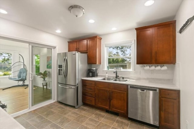 14 Carlson Cv, Weymouth, MA 02189 - kitchen featuring stainless steel appliances, a sink, light countertops, recessed lighting, and brown cabinetry