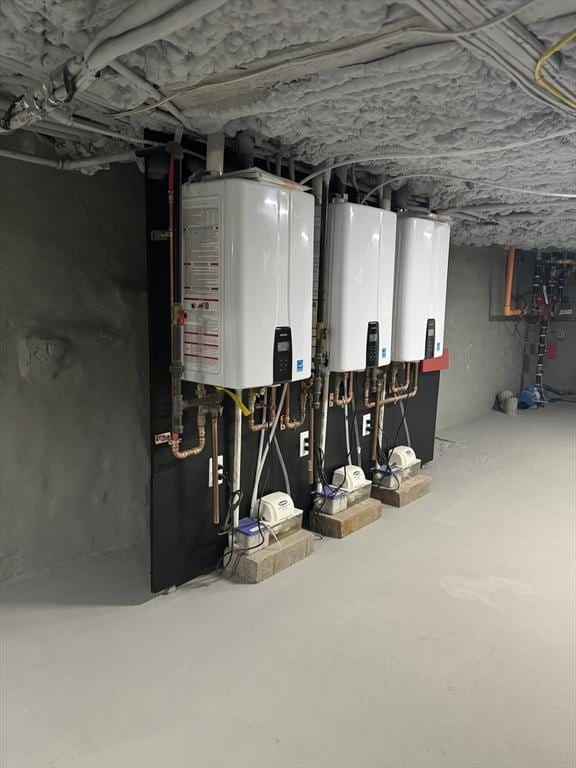 utility room featuring tankless water heater