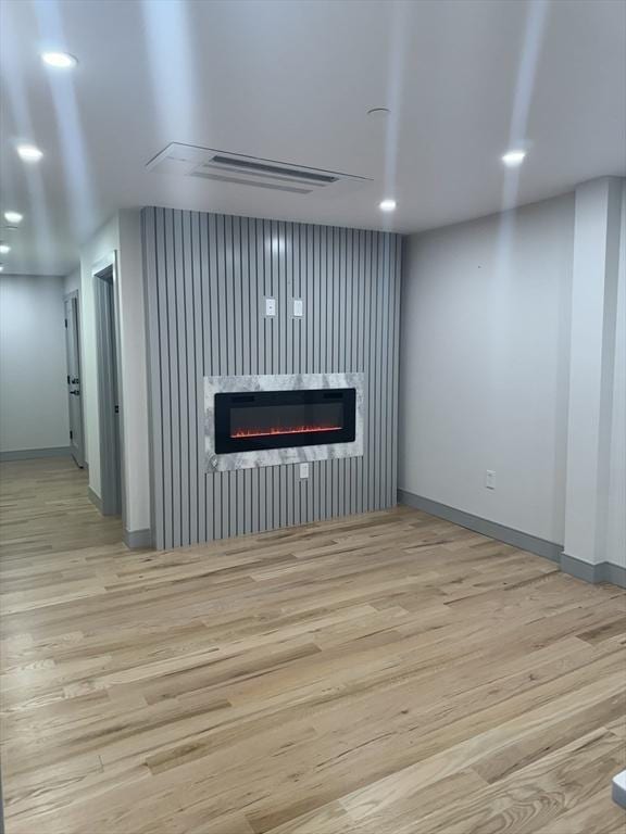 unfurnished living room featuring light wood-type flooring