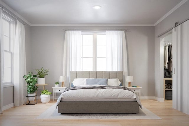 bedroom with baseboards, crown molding, and wood finished floors