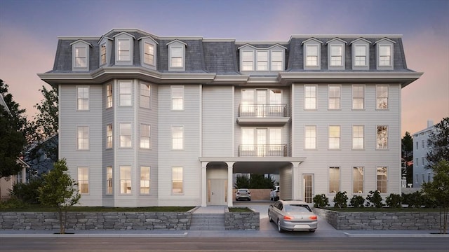 exterior space featuring mansard roof