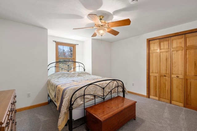 carpeted bedroom with a ceiling fan, baseboards, and a closet
