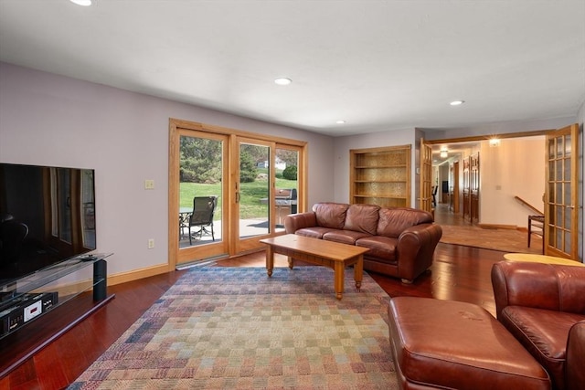 living area with baseboards, recessed lighting, and wood finished floors