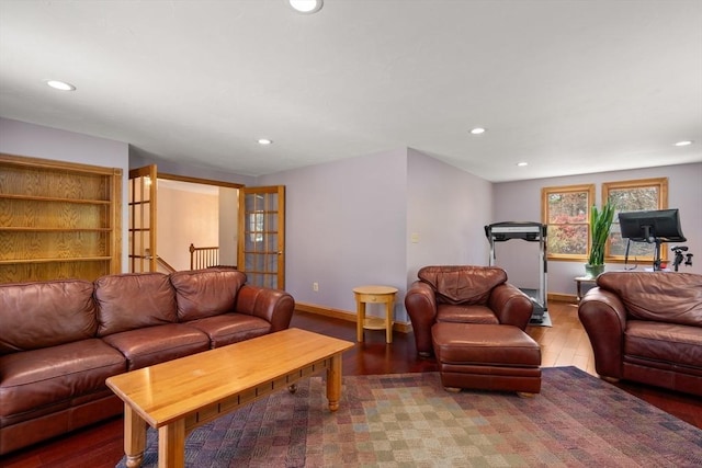 living room with recessed lighting and wood finished floors
