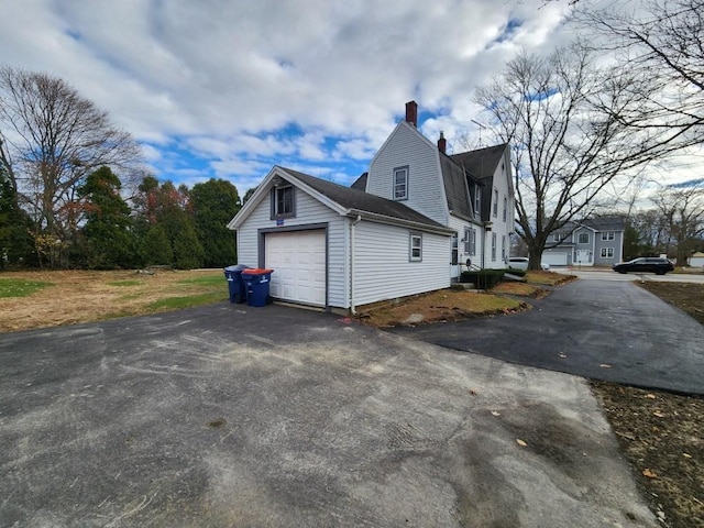 view of property exterior with a garage