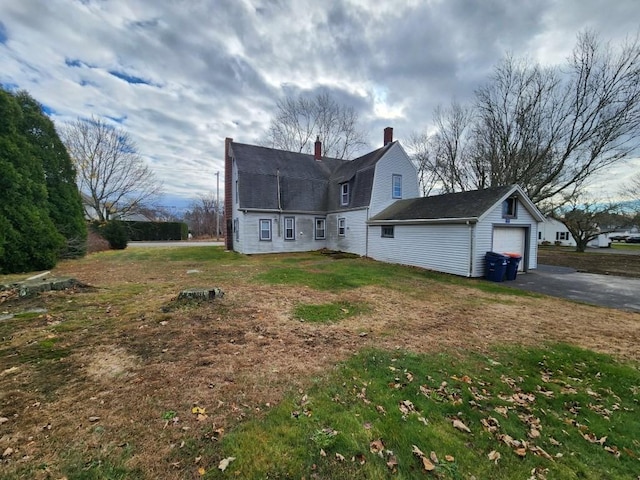 rear view of house featuring a lawn