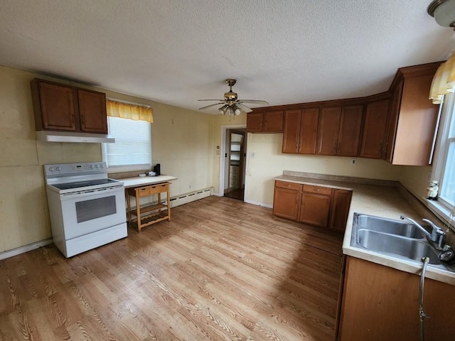 kitchen with ceiling fan, sink, light hardwood / wood-style flooring, white electric stove, and a textured ceiling