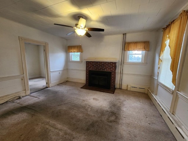 unfurnished living room with a fireplace, light colored carpet, baseboard heating, and ceiling fan