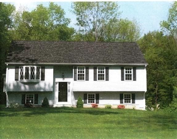 split foyer home with a front yard