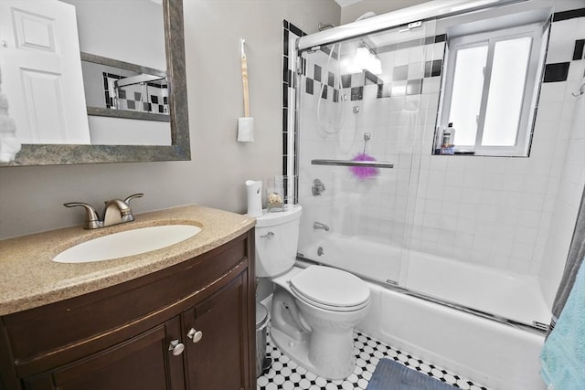 full bathroom featuring tile patterned flooring, vanity, toilet, and enclosed tub / shower combo