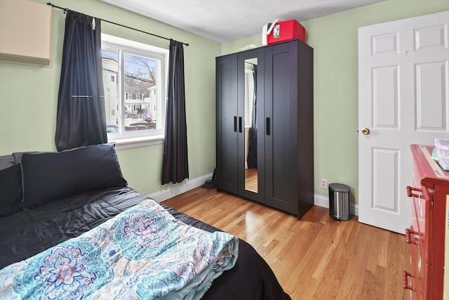 bedroom with light wood-type flooring