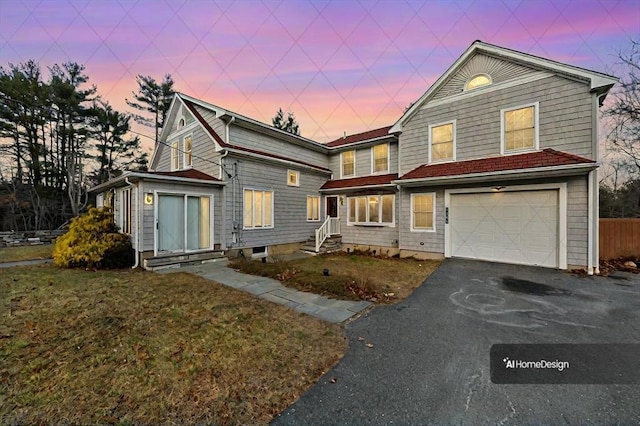 view of front property with a garage and a yard