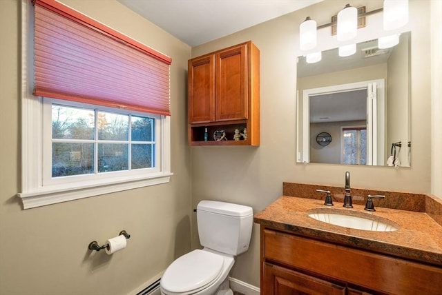 bathroom featuring toilet and vanity