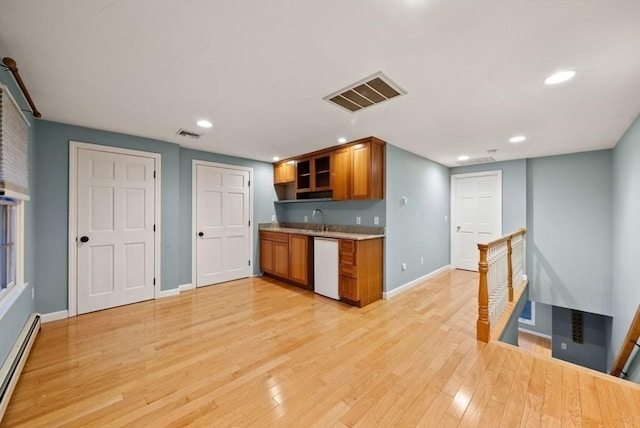 kitchen with sink, light hardwood / wood-style flooring, dishwasher, and a baseboard heating unit