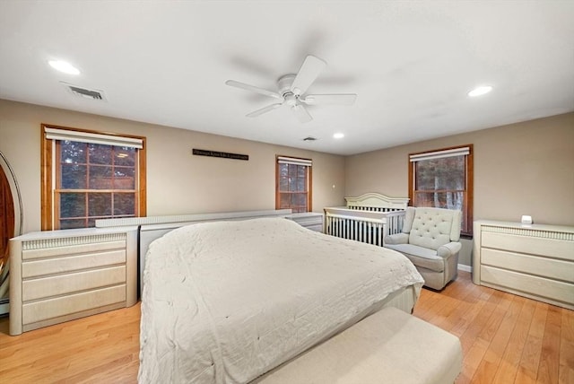 bedroom featuring ceiling fan and light hardwood / wood-style flooring