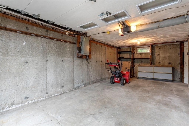 garage featuring a garage door opener and electric panel