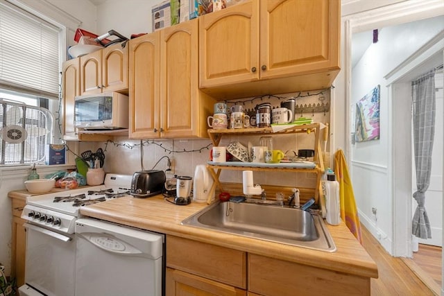 39 Glenville Ave Unit 2, Boston, MA 02134 - kitchen with white appliances, tasteful backsplash, light wood-style flooring, and light brown cabinetry