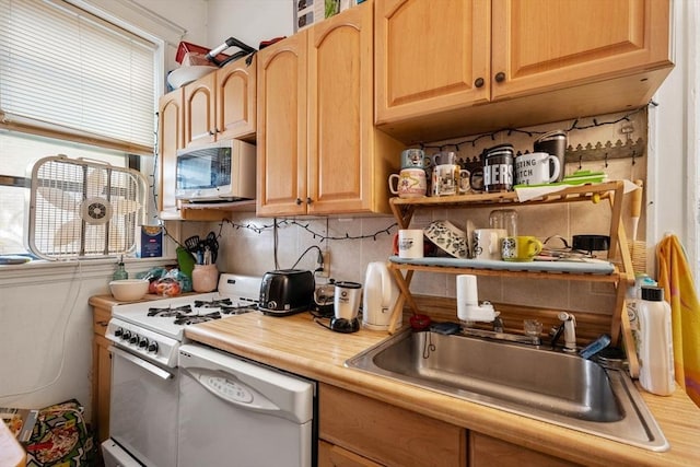 39 Glenville Ave Unit 2, Boston, MA 02134 - kitchen featuring white appliances, plenty of natural light, tasteful backsplash, and light countertops