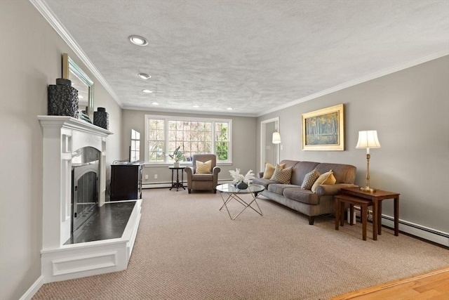 living area with baseboards, a fireplace with raised hearth, a baseboard heating unit, ornamental molding, and recessed lighting