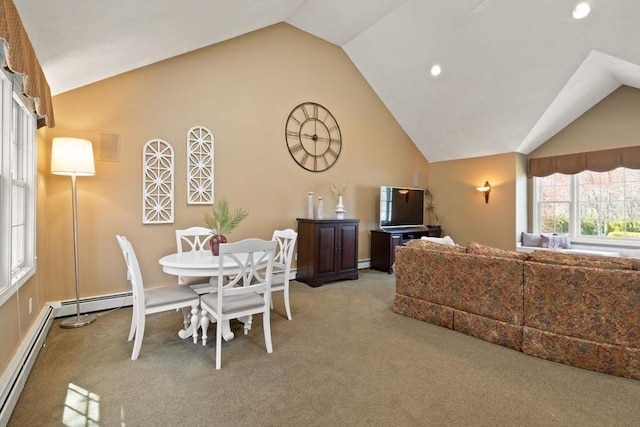 dining room featuring carpet, a baseboard heating unit, recessed lighting, and lofted ceiling
